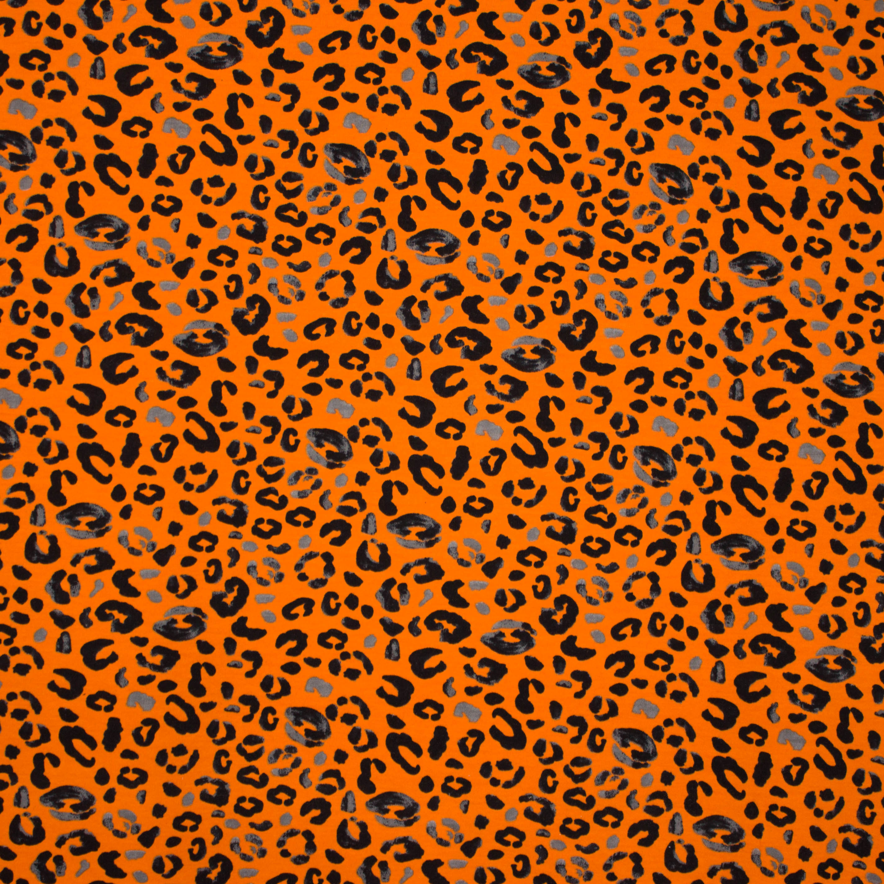 Oranje sweaterstof met panterprint van 'Poppy'
