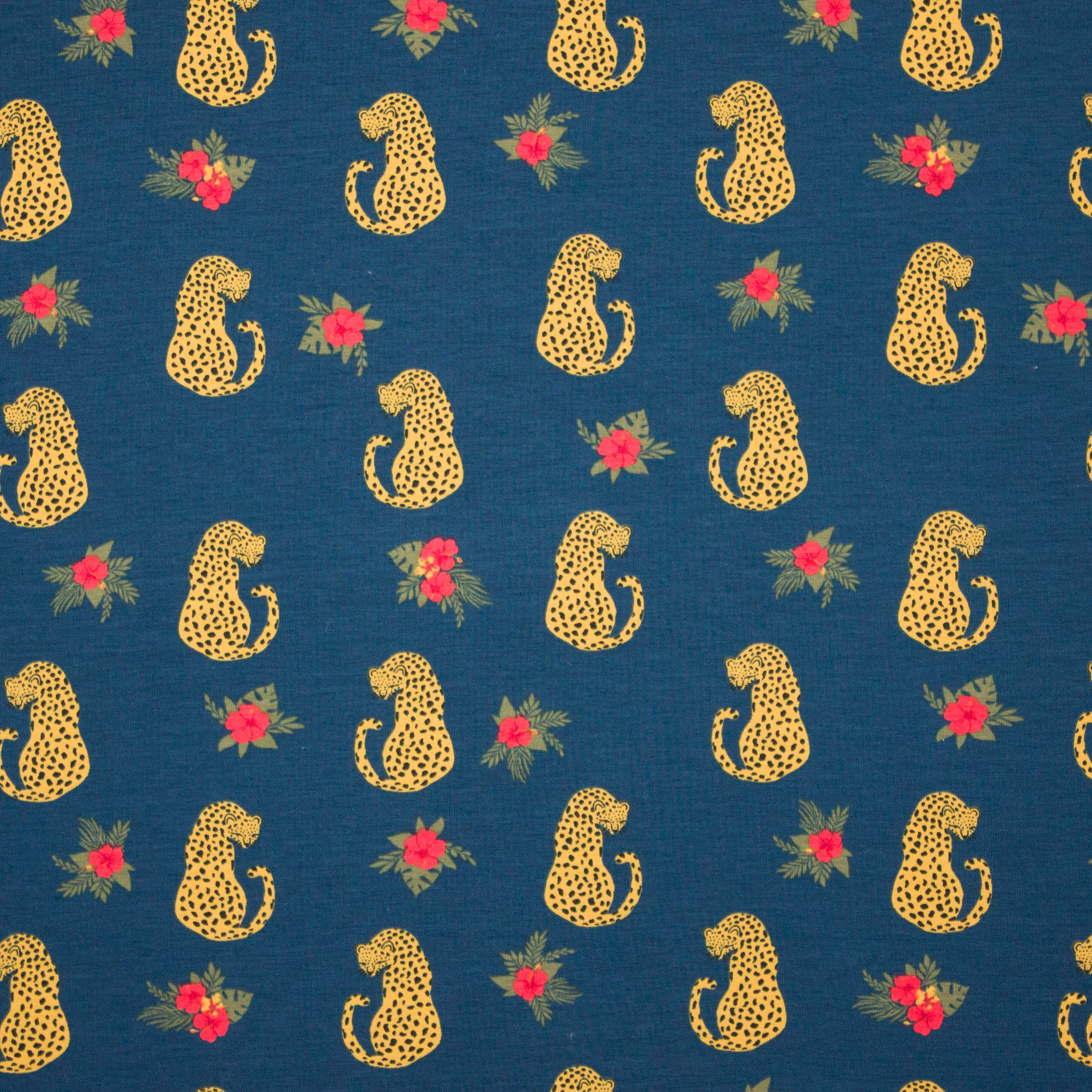 Blauwe sweaterstof met panters en bloemen