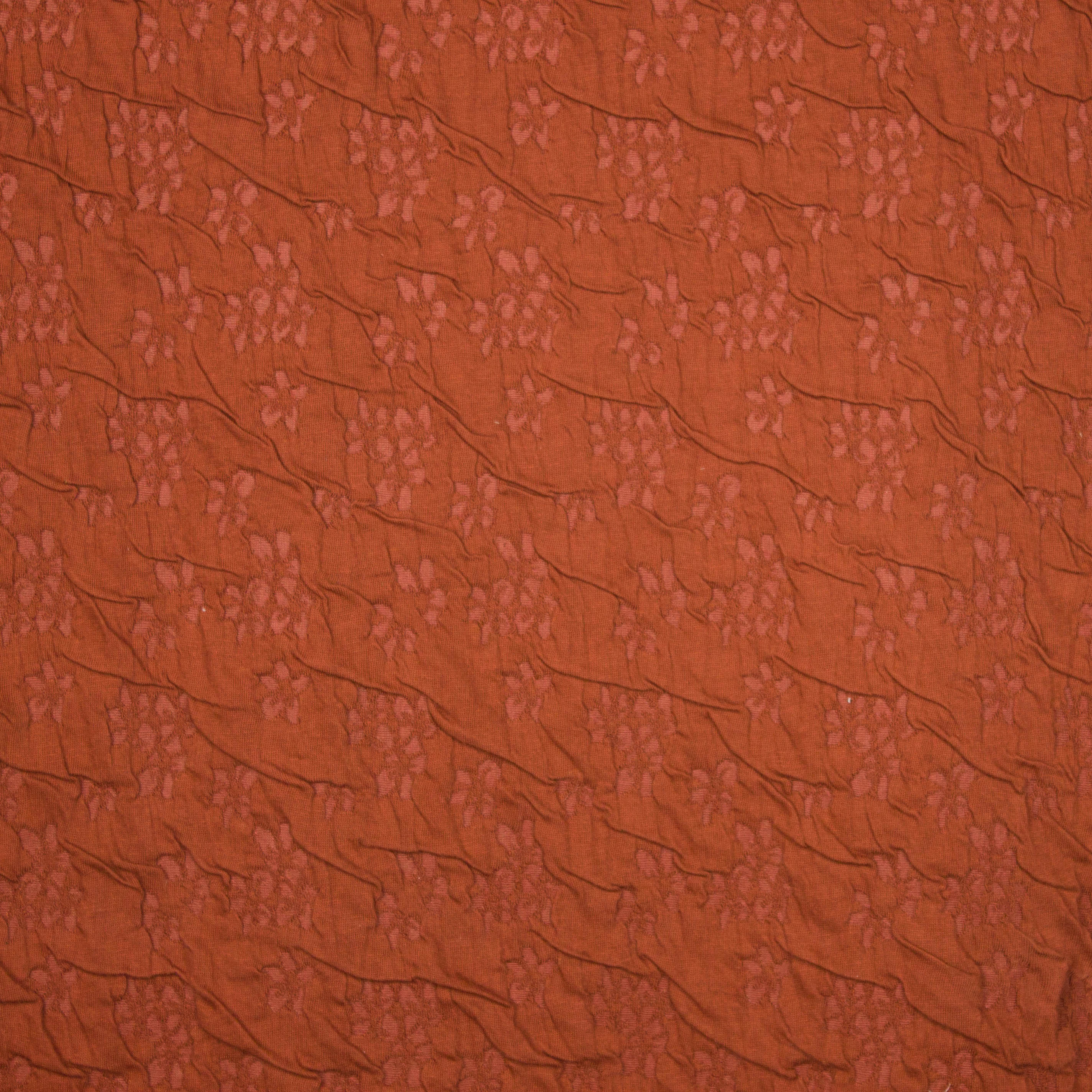 Roestkleurige  viscose structuurtricot met een fijn bloemetjes motiefje