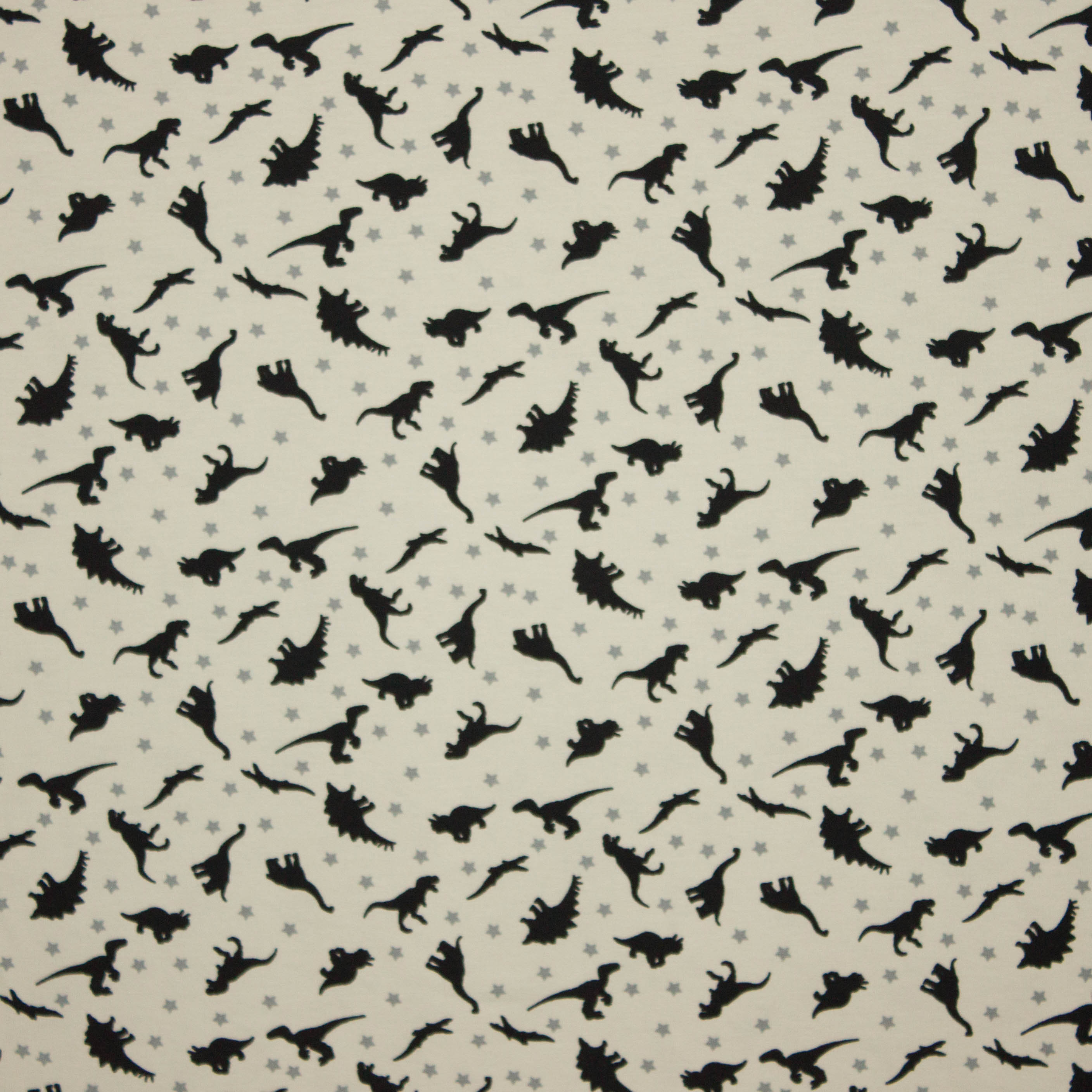 Creme katoen tricot met dinosaurus motief