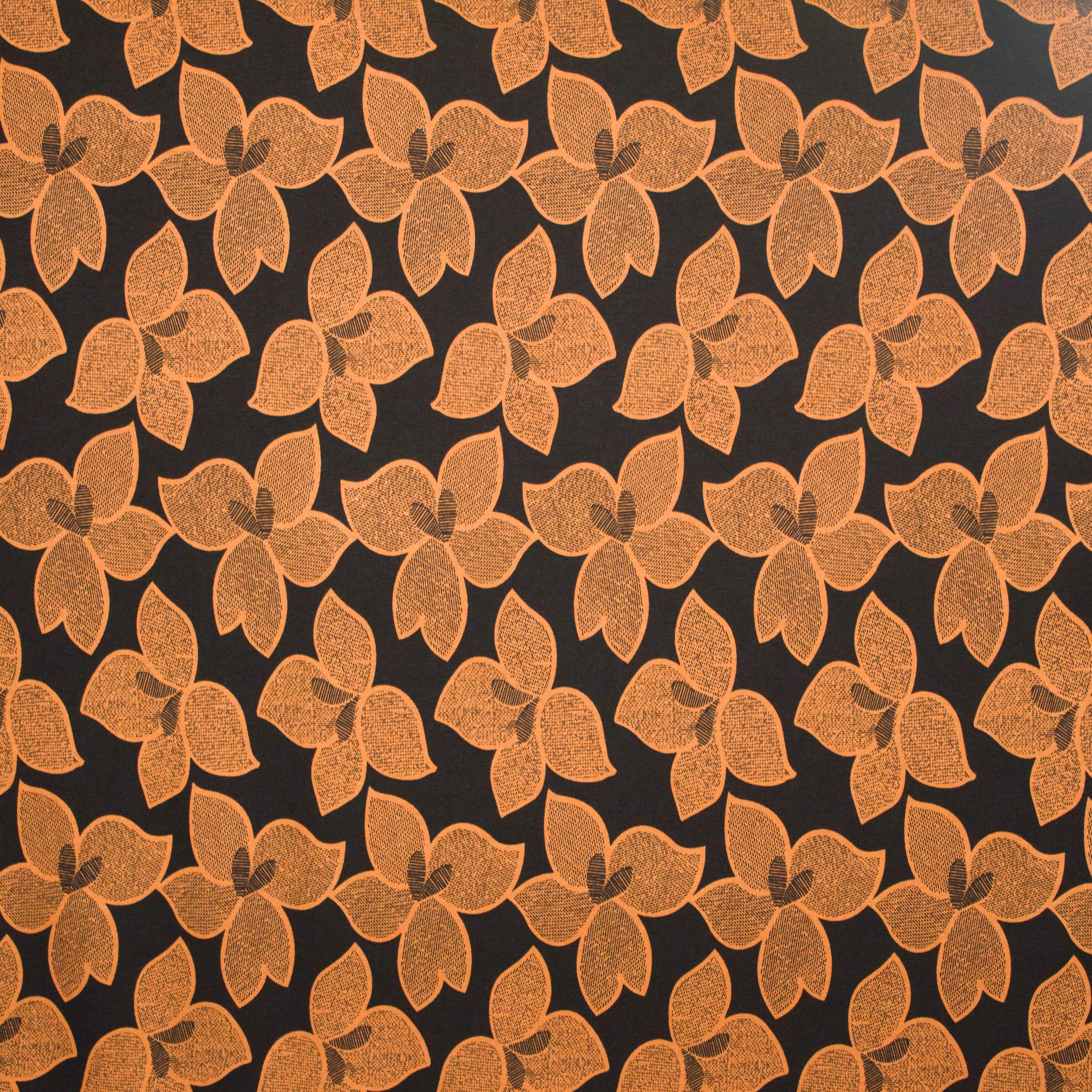 Zwarte viscose  tricot met oker bloemenmotief