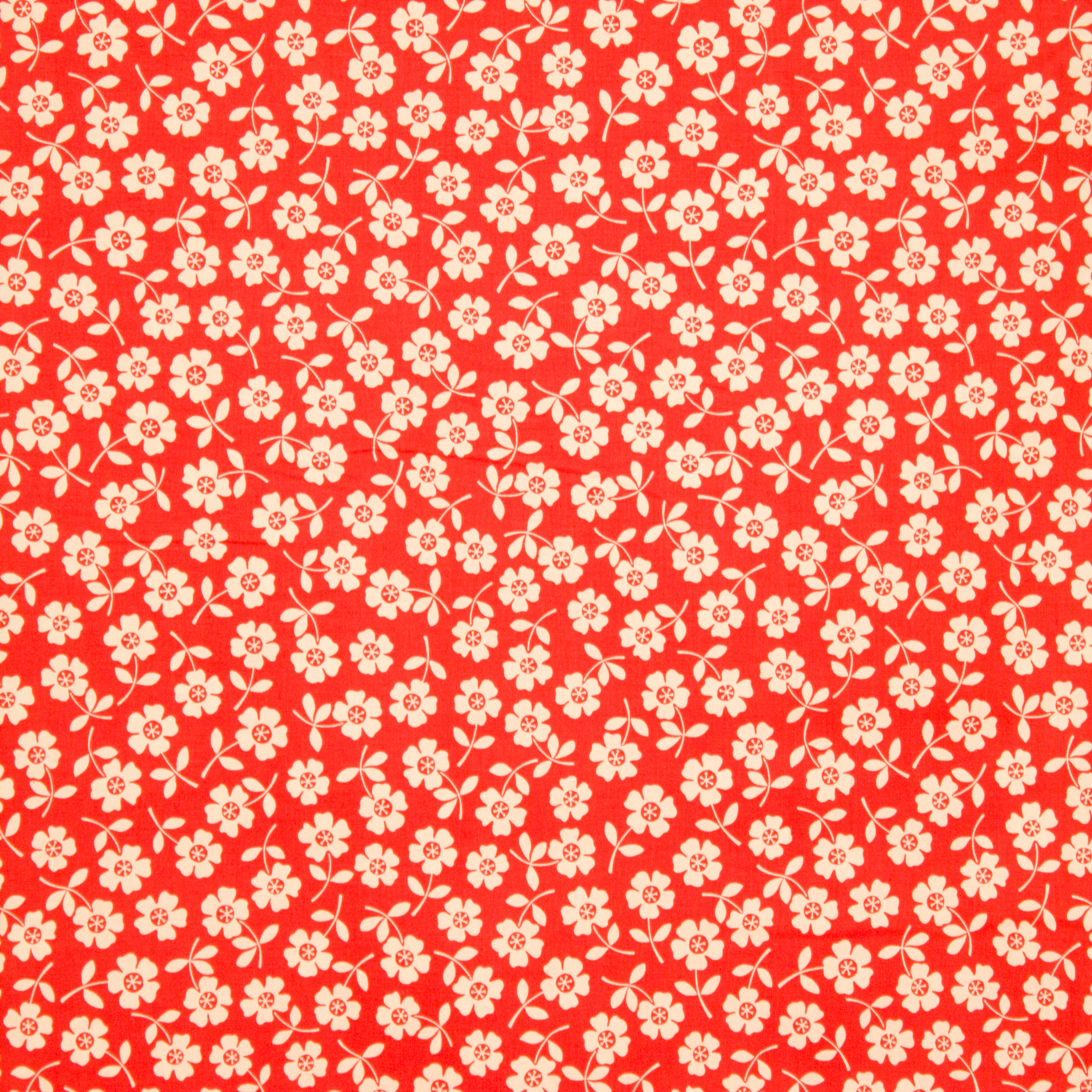 Oranje katoen met witte bloemen