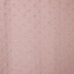 Roze tricot met dotjes bovenop de stof