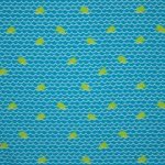 Turquoise badpakkenstof met dessin van walvissen en golven