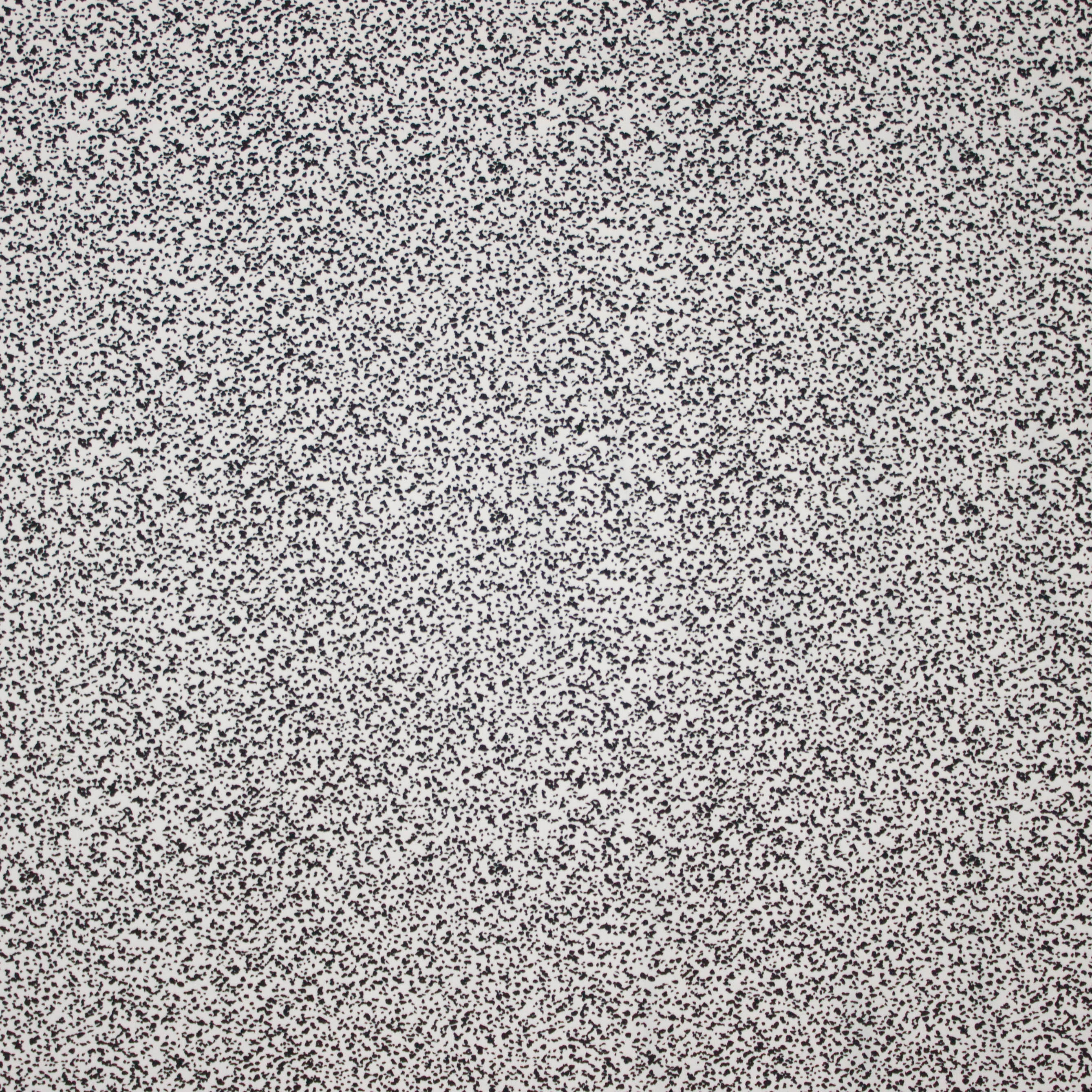 Witte tricot met zwarte vlekjes