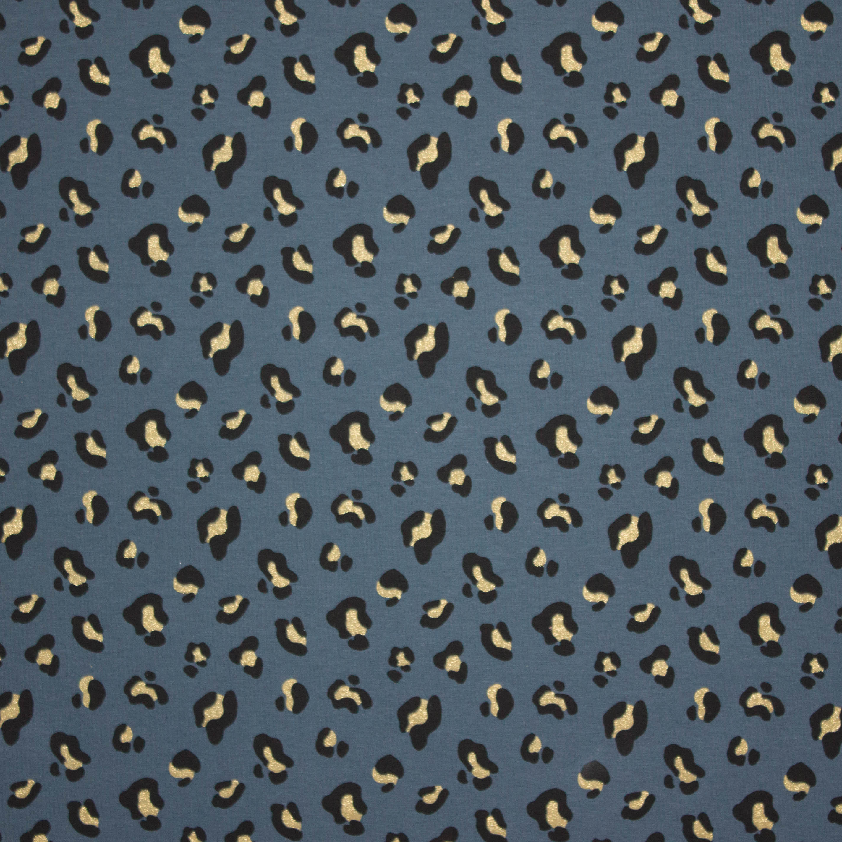 Blauwe tricot met pantervlekken in zwart en gouden glitter