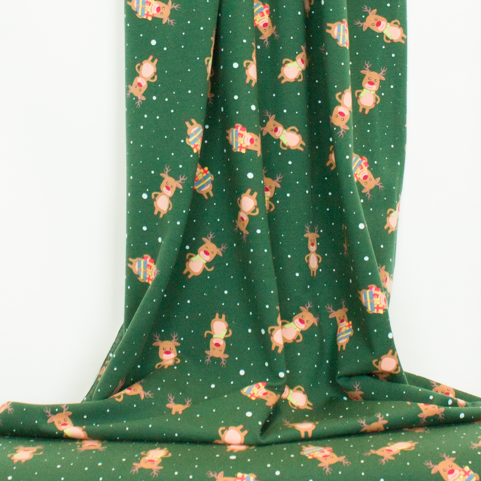 Groene french terry met rendieren en sneeuwvlokken