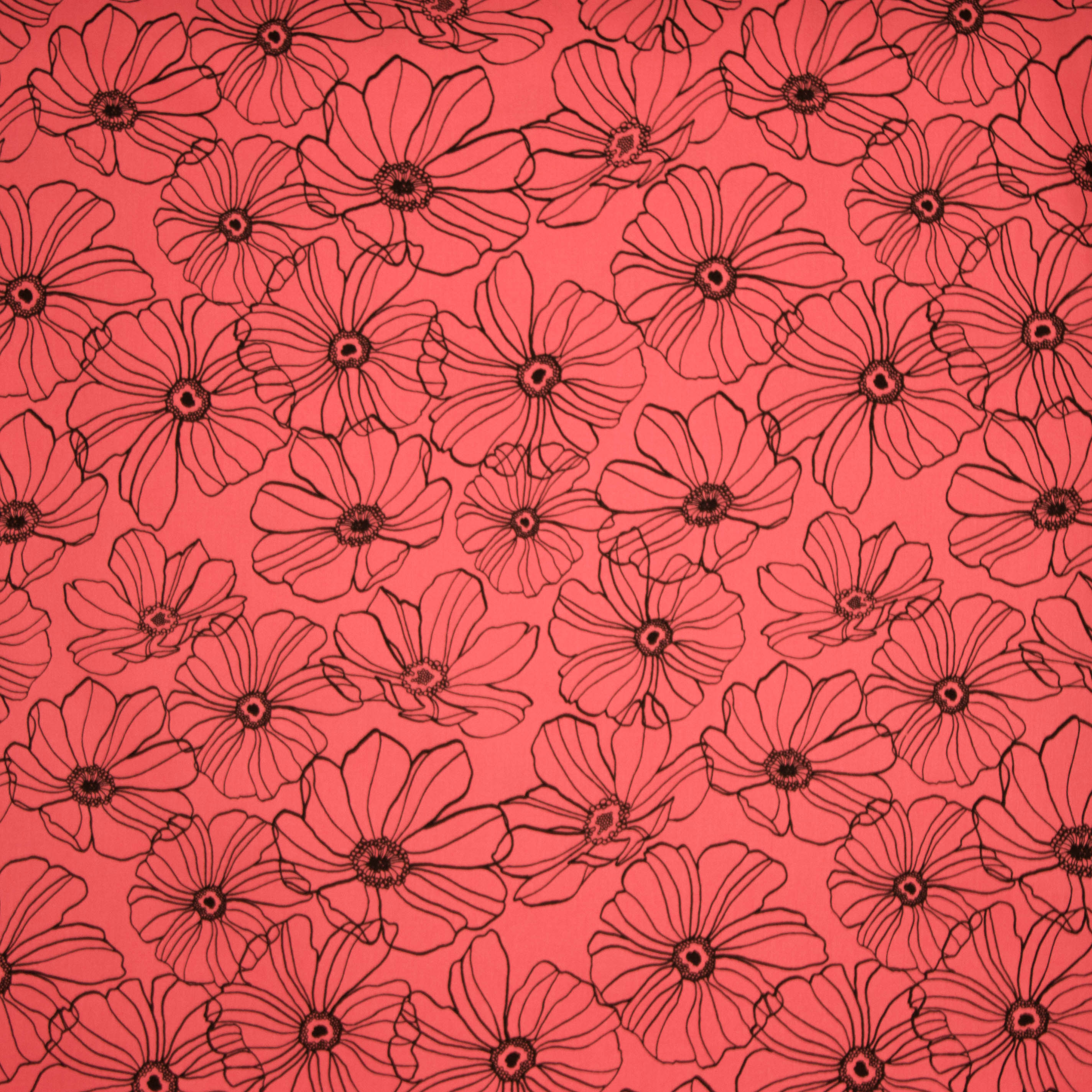 Koraalkleurige rekbare katoen met zwarte bloemen van Penelope