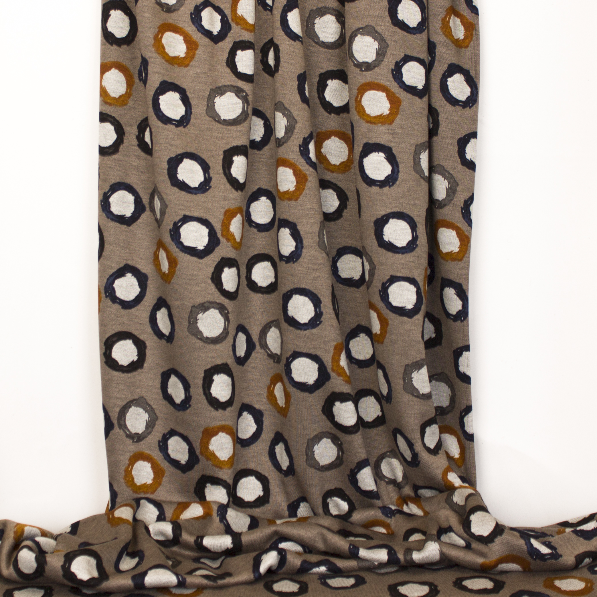 Taupe viscose/polyester tricot met bollen motief van 'Miss Doodle'