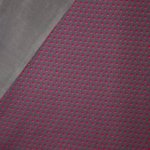 Donkergrijze sweaterstof met bolletjesmotief en zachte grijze achterkant