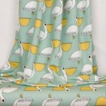 Munt french terry met pelikanen van Eva Mouton